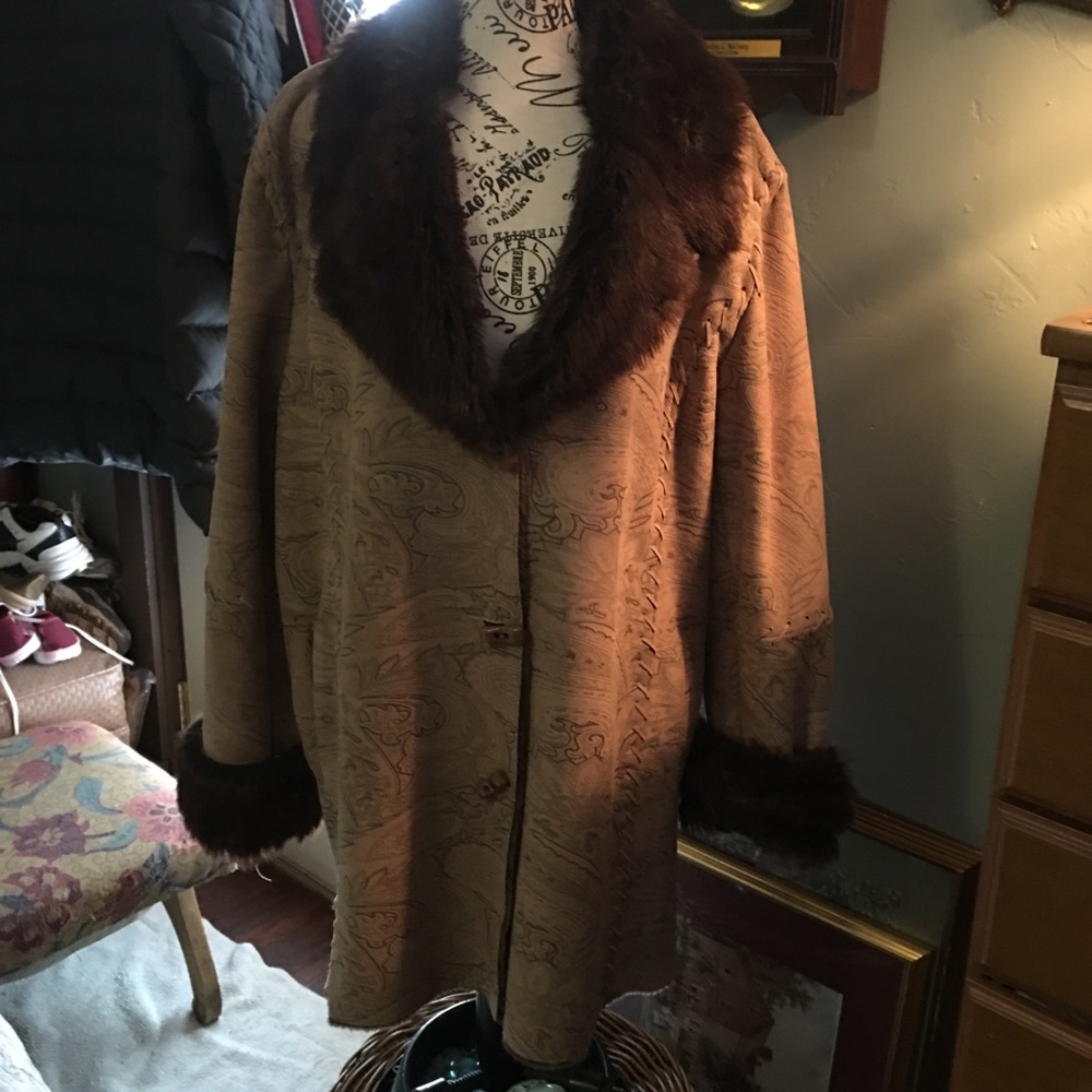 Leather coat. Imprinted design in taupes. Beautifully detailed toggle buttons.
